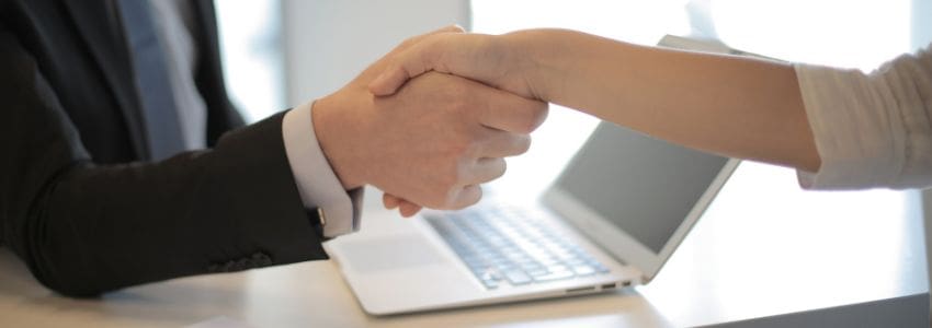 Image of handshake confirming employment hire