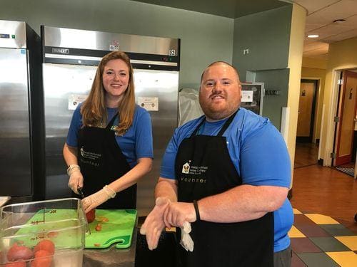 Sammie Osborne and Mike Coletrain preparing a meal at Ronald McDonald House