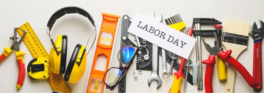 A variety of work tools with the sign "labor day"