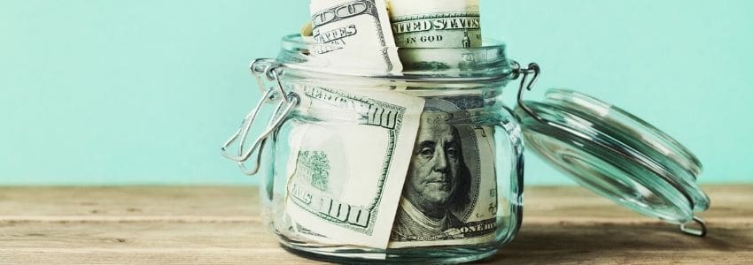 Image of money in a jar representing performance bonuses