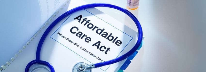 Affordable Care Act (ACA reporting) information booklet with stethoscope