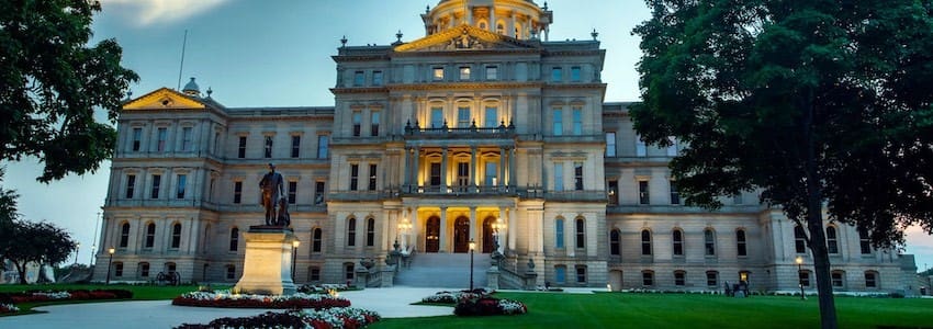 Michigan State Capital at dusk with building lights on.