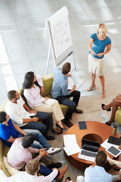 An overhead view of an instructor leading a Five Behaviors training session.